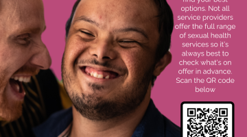 Care worker hugging man with special educational needs.