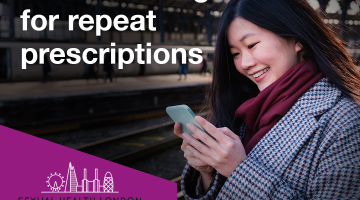 Woman scrolling on phone at train station